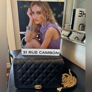 Authentic Chanel WOC caviar black gold hardware.